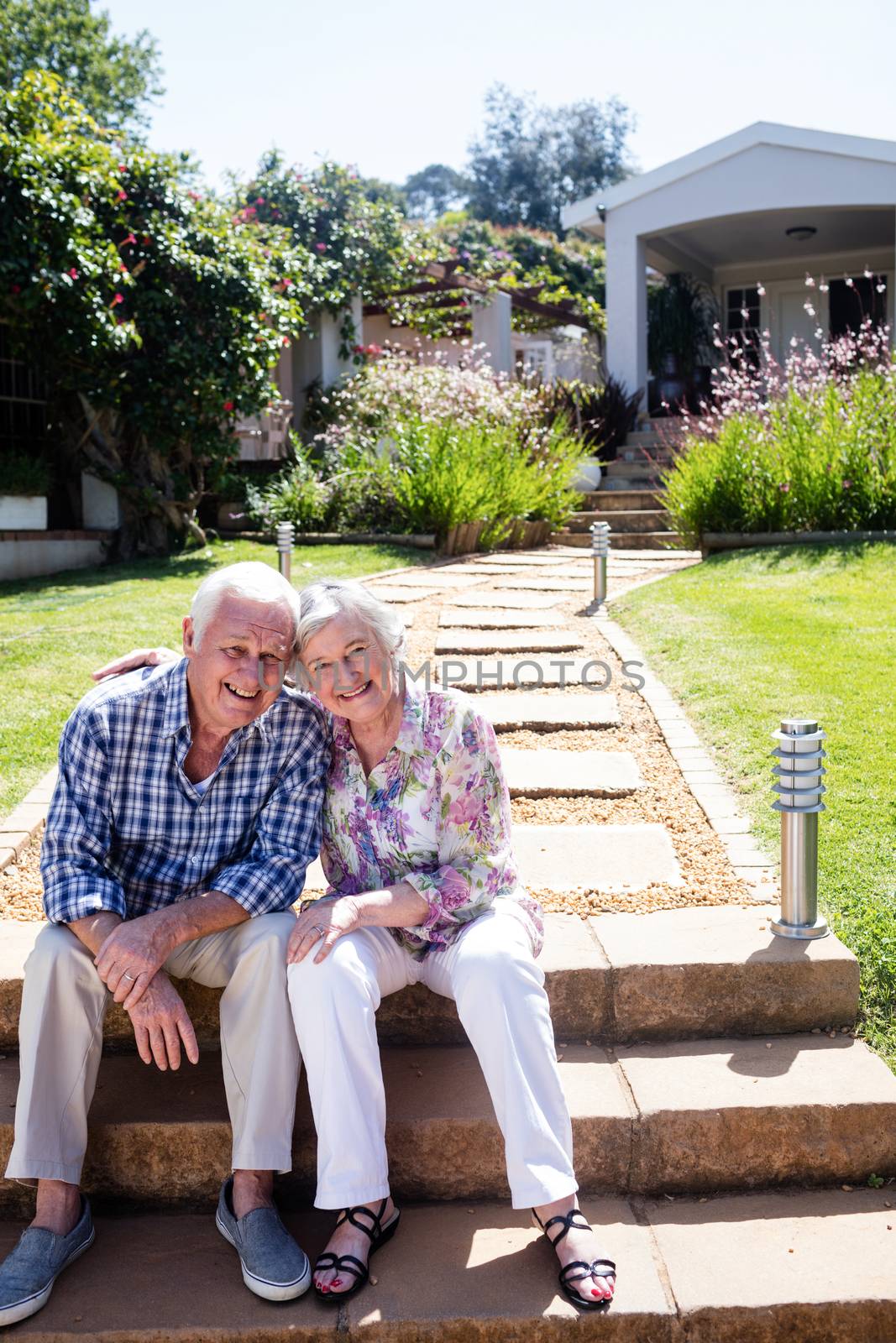 Senior couple embracing in the garden by Wavebreakmedia