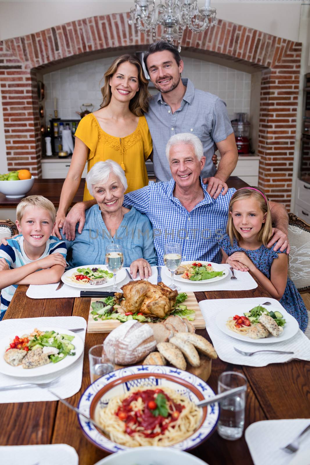 Portrait of multi-generation family having meal at home