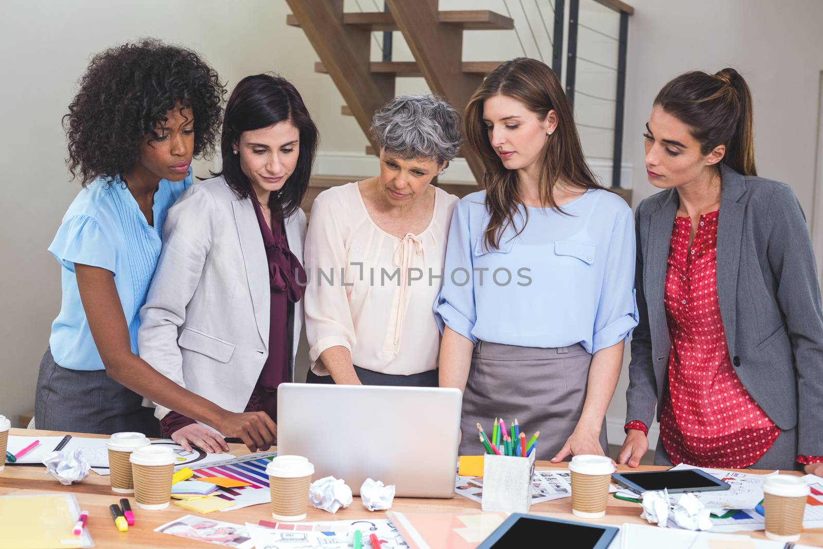 Group of interior designer using laptop in office