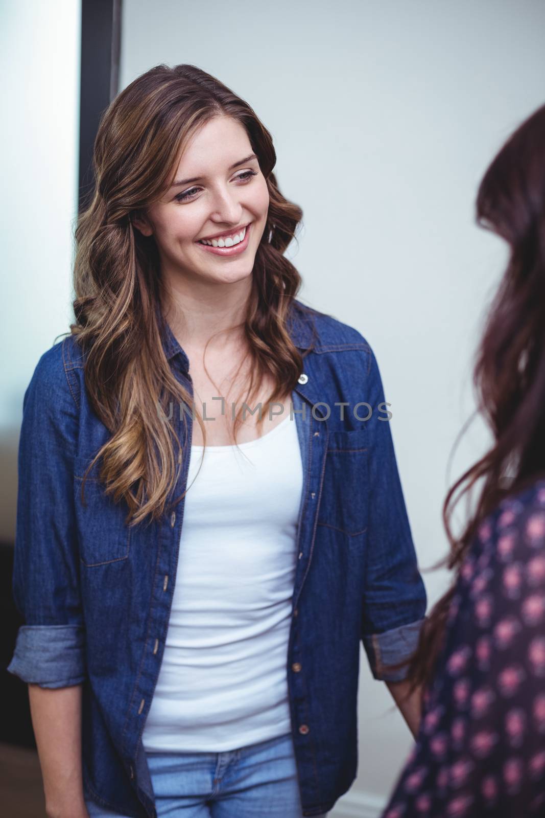 Beautiful women interacting with each other at home