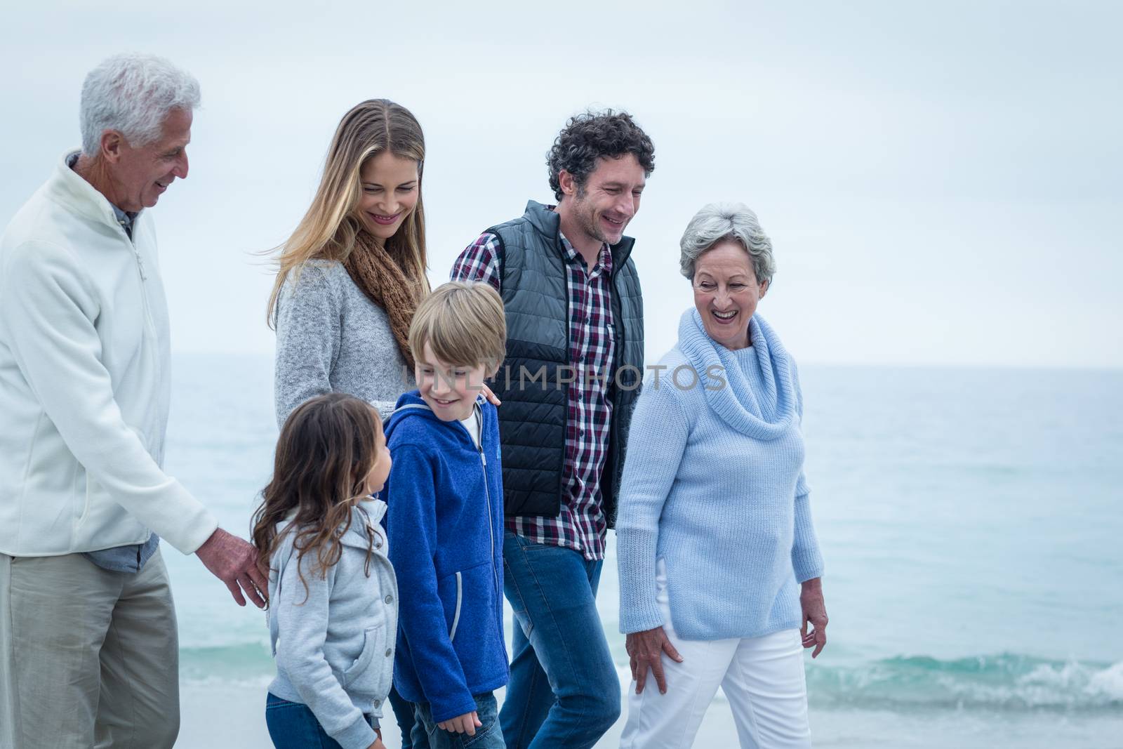 Family walking at beach by Wavebreakmedia