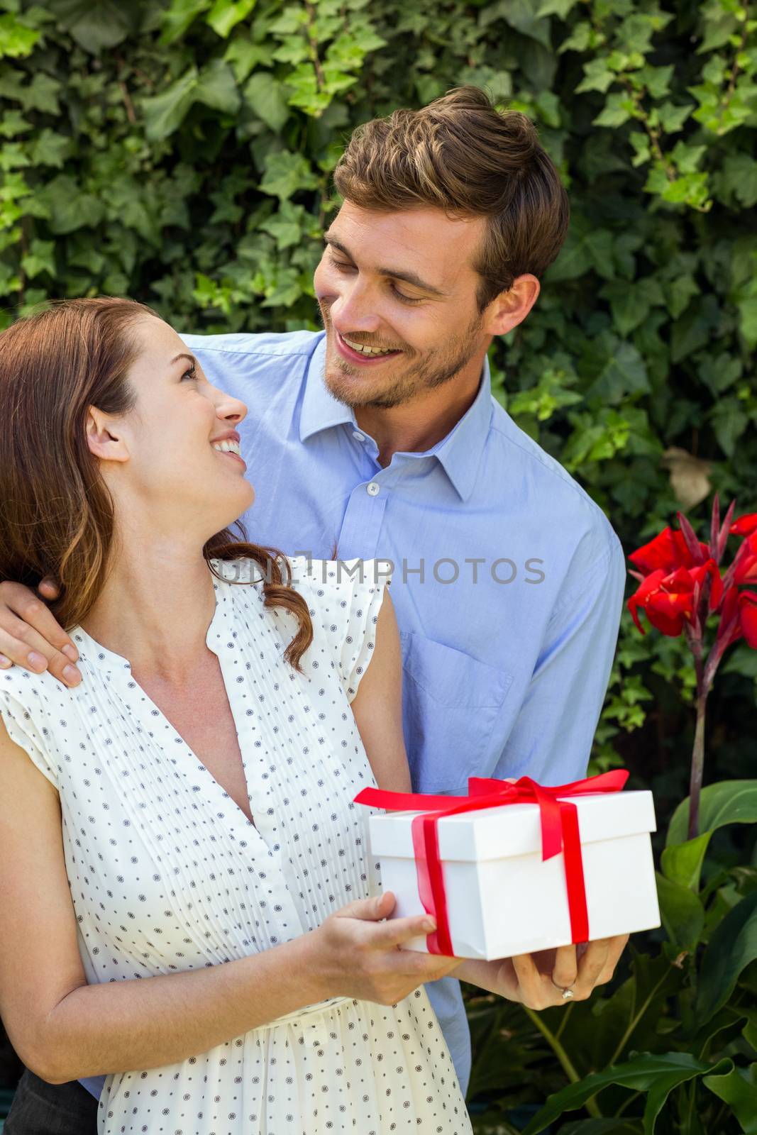 Romantic man giving gift to woman by Wavebreakmedia