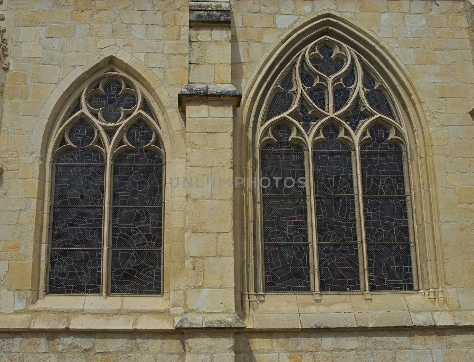Two windows in gothic style at catholic cathedral