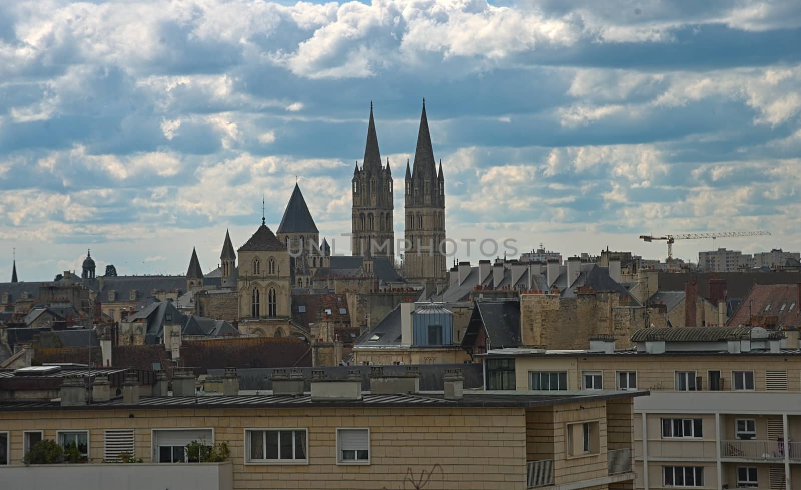 Cityscape of French city Caen with high tower of an catholic cathedral by sheriffkule