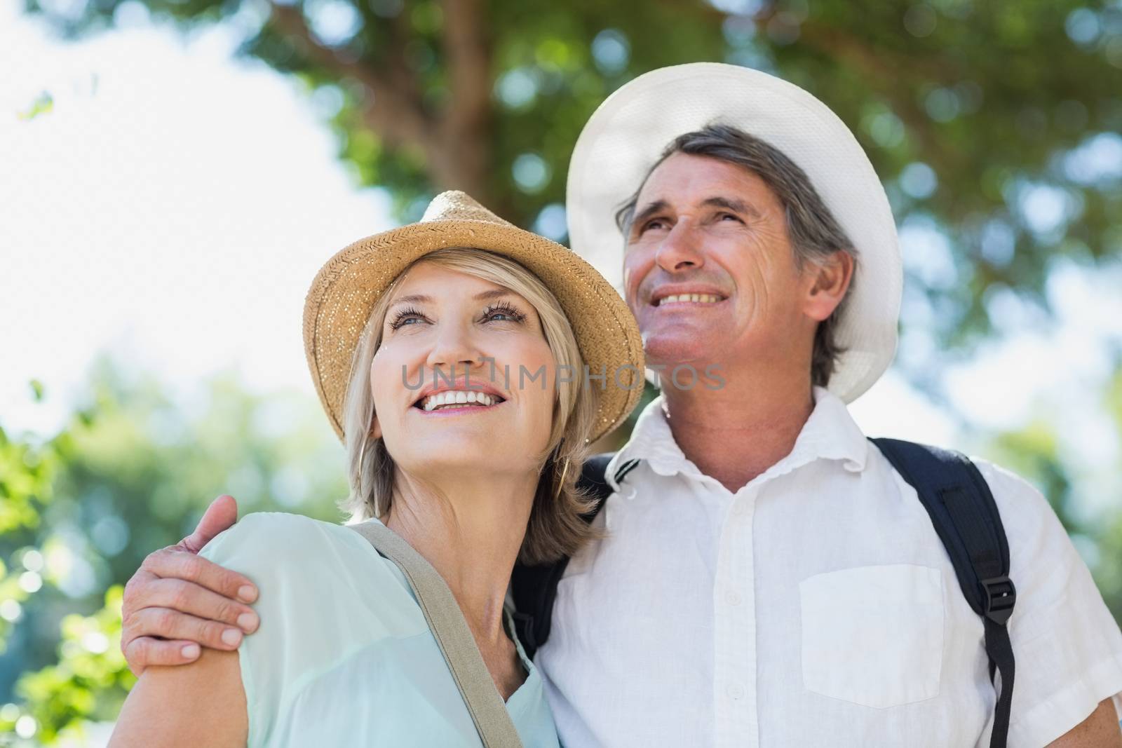 Happy couple on city break standing outdoors