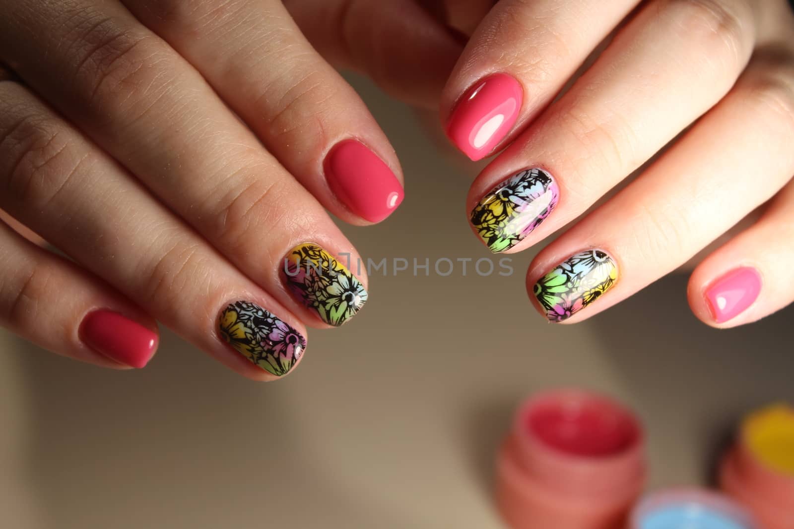 Bright, colorful design of manicure by SmirMaxStock