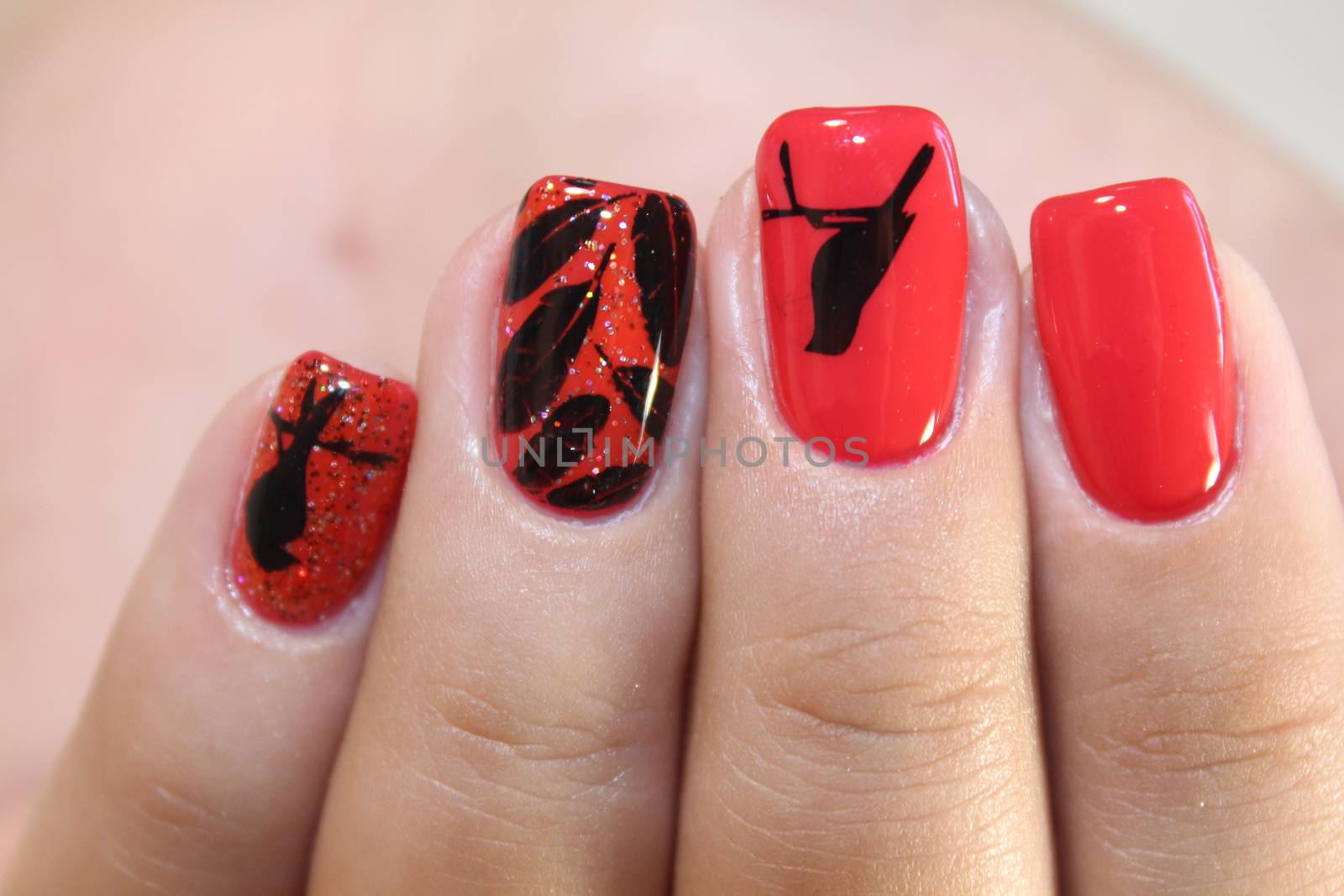 Manicure design red nails with pattern by SmirMaxStock