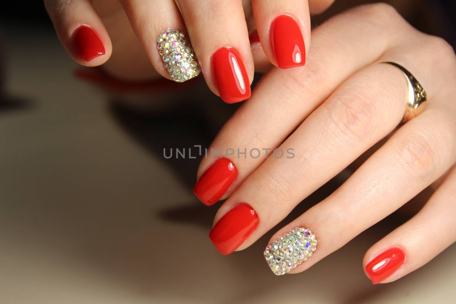 Red nails with rhinestones by SmirMaxStock