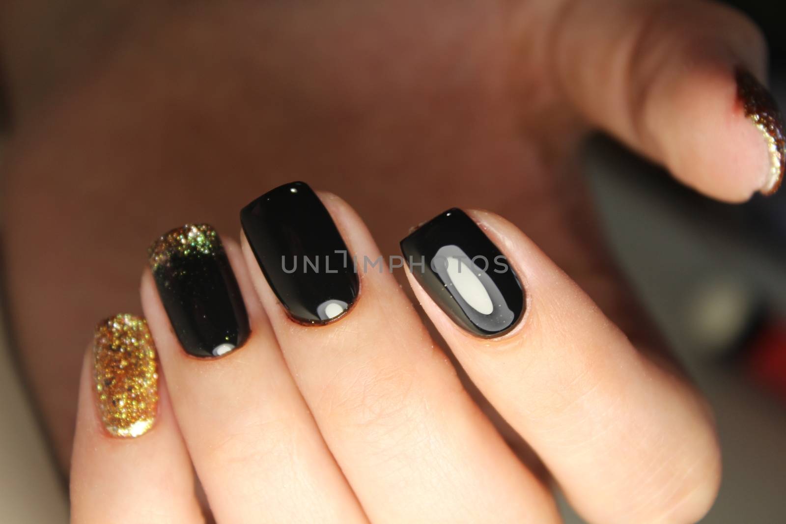 manicure design black and gold color by SmirMaxStock