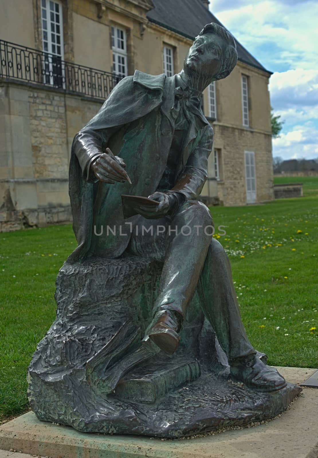 Sculpture of a poet in front of an museum of Normandy in Caen, France