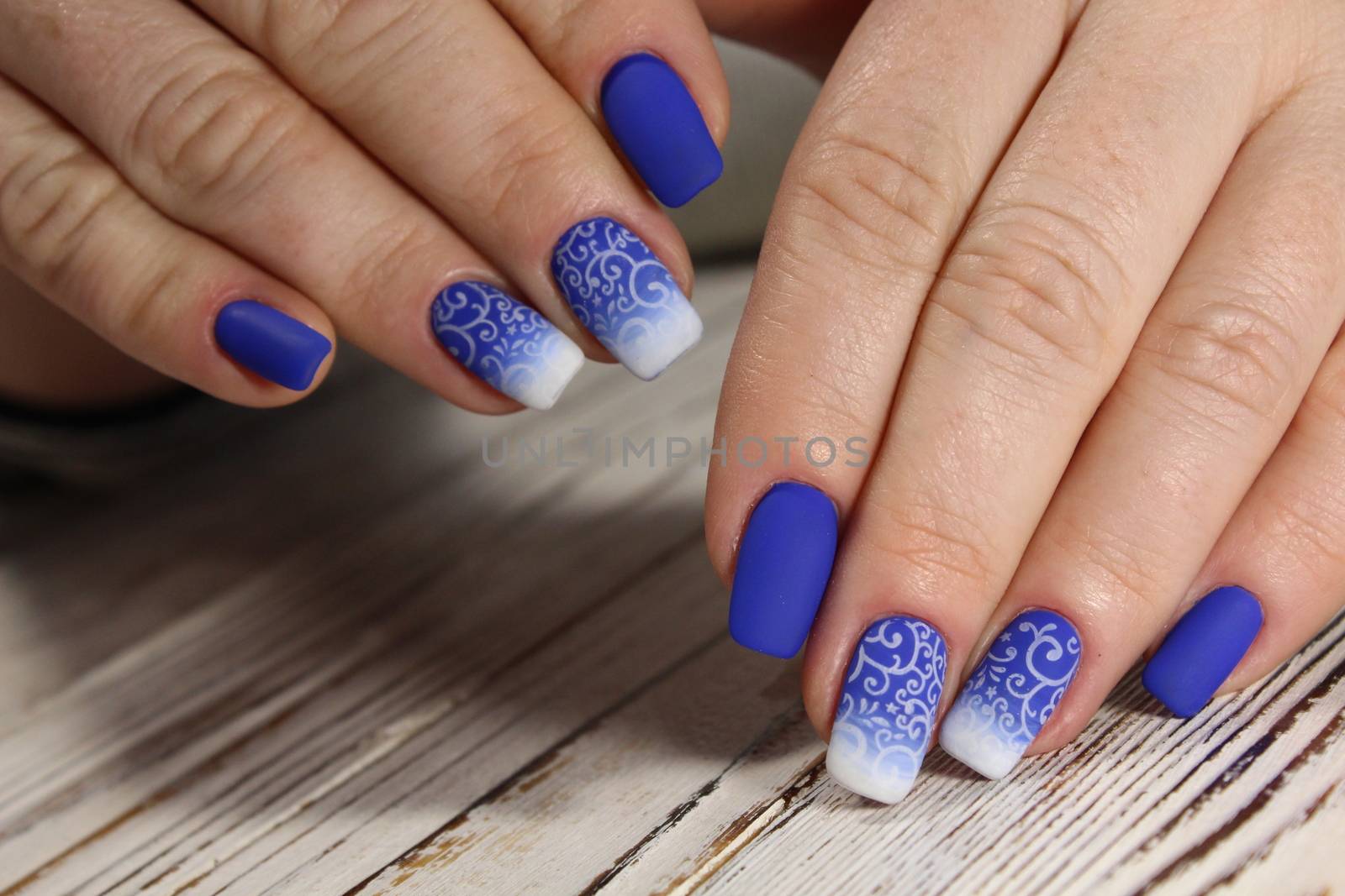 Bright, colorful design of manicure by SmirMaxStock