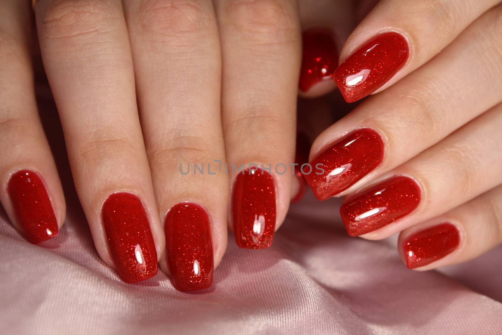 Bright red manicure design with gel varnish