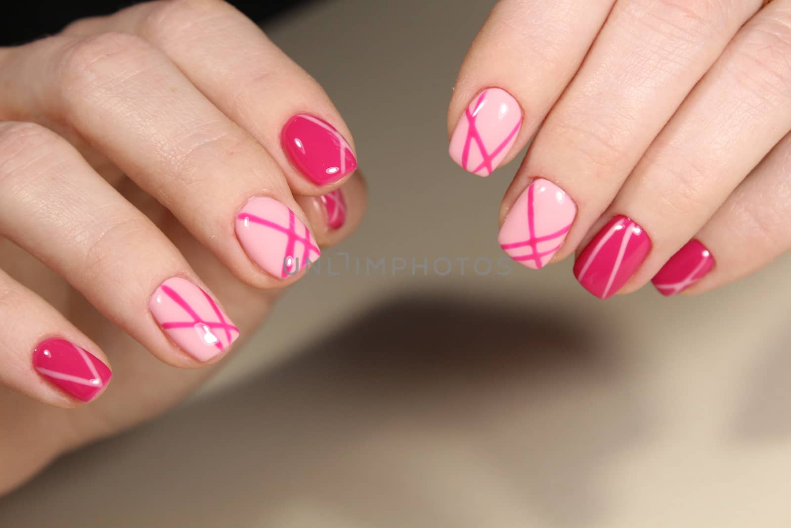 Manicured nails with pink nail polish. Manicure with nailpolish. Fashion art