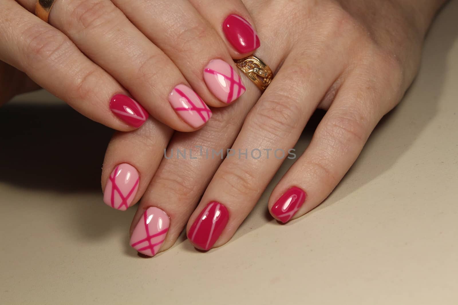 Manicured nails with pink nail polish. by SmirMaxStock