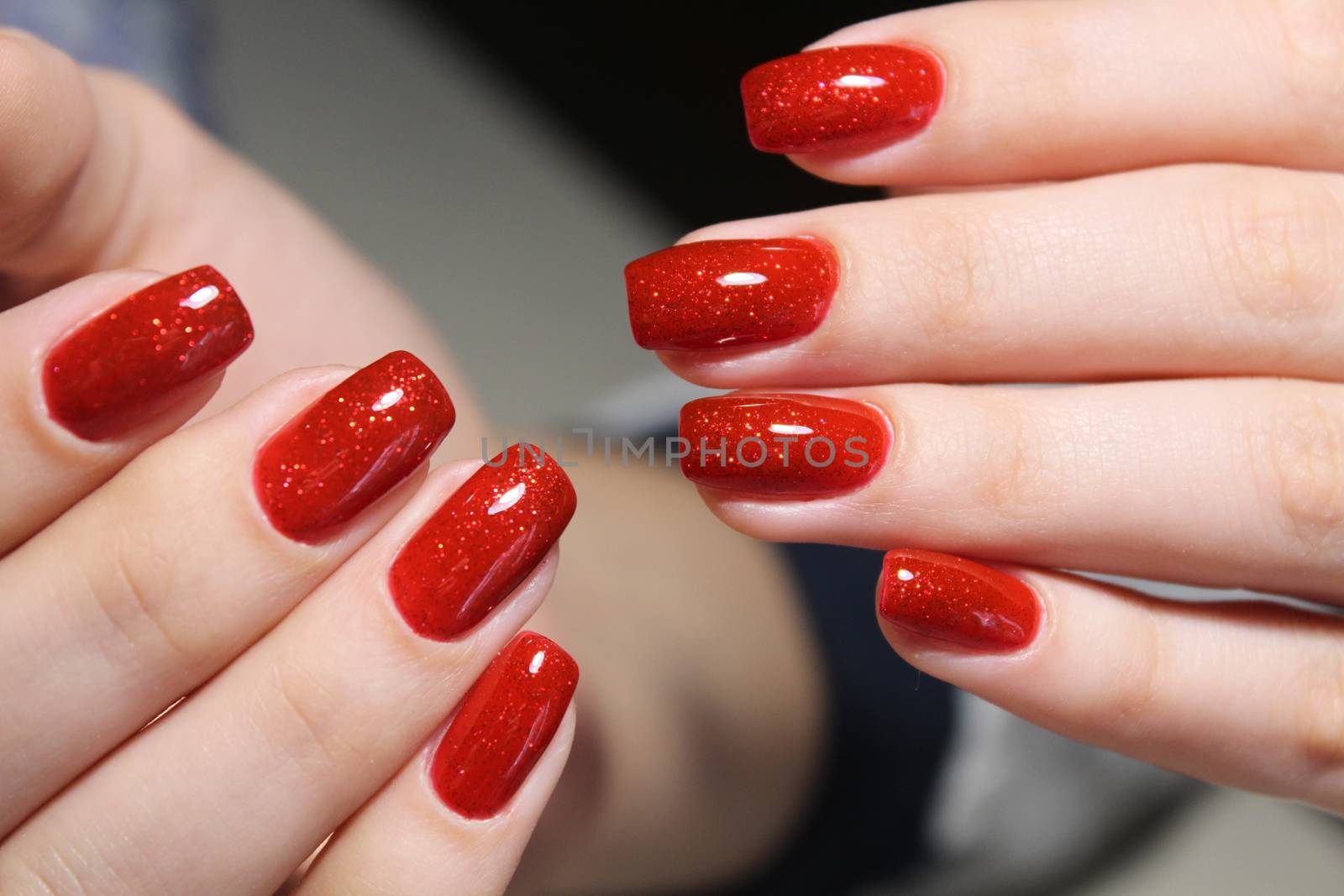 Bright red manicure design by SmirMaxStock