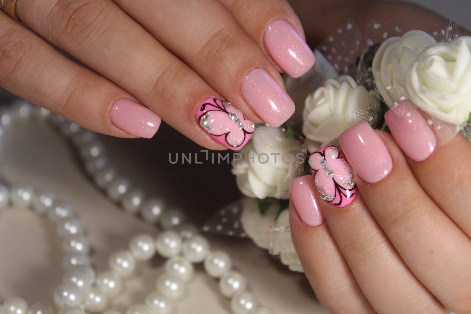Manicure nail design with a butterfly pattern by SmirMaxStock