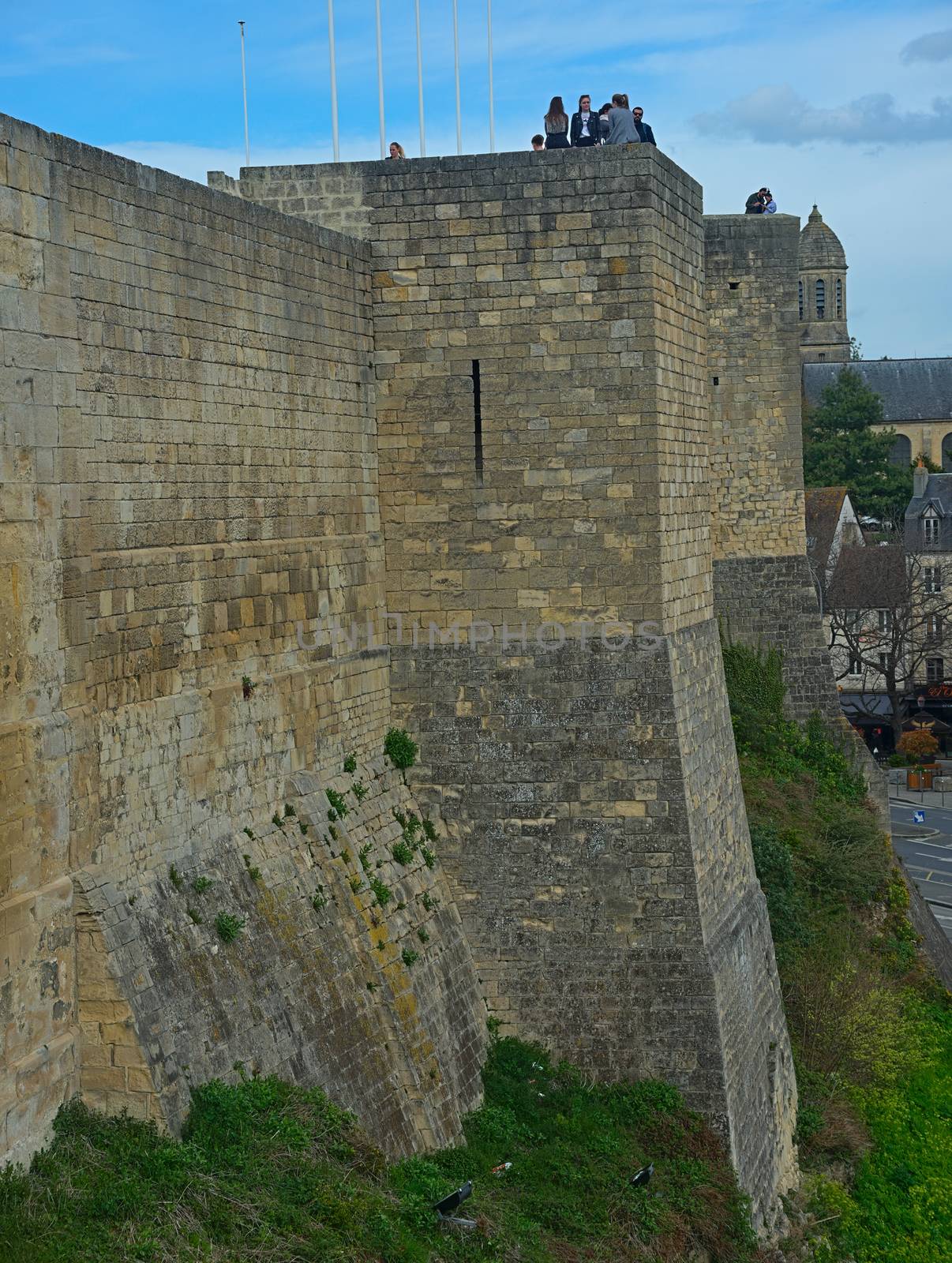 CAEN, FRANCE - April 7th 2019 - View on huge stone defensive wall and tower at fortress by sheriffkule