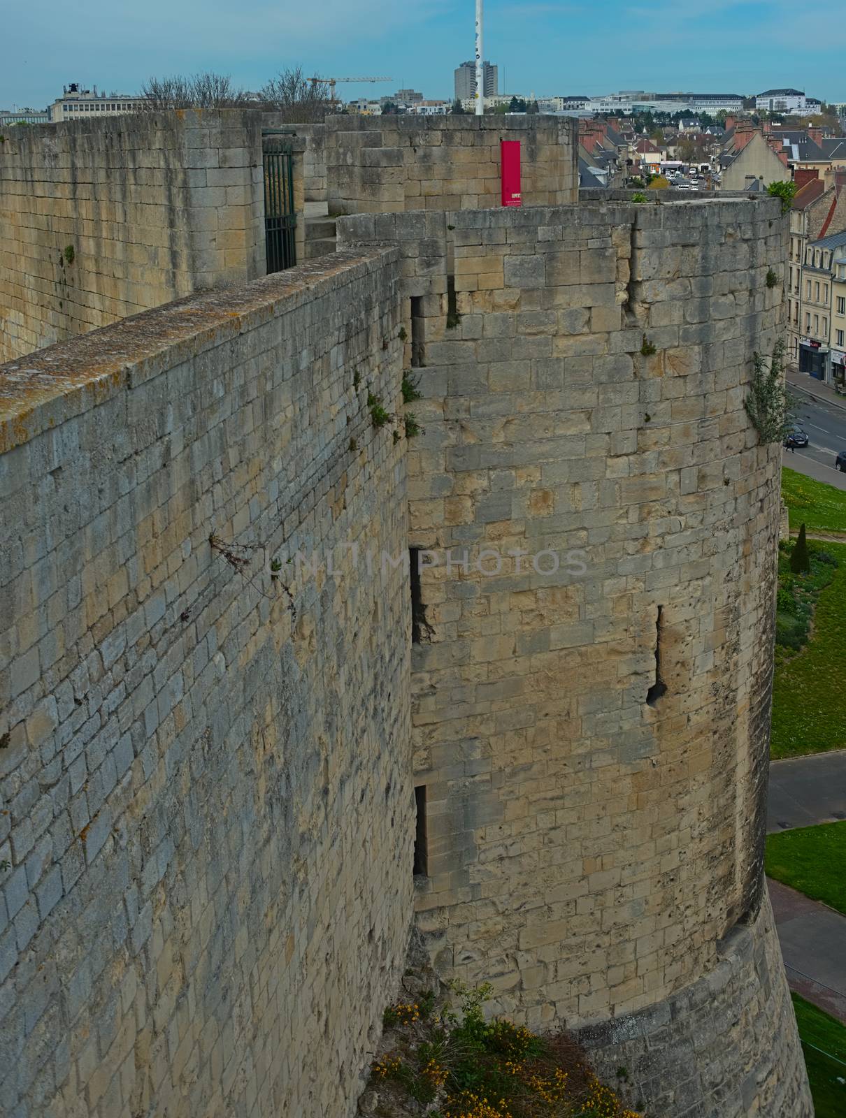 View on huge stone defensive wall and tower at Caen fortress, France by sheriffkule