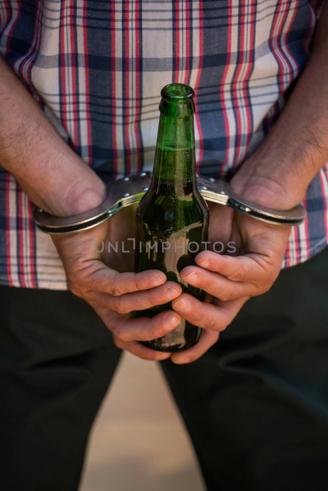 Man handcuffed behind his back for drinking and driving