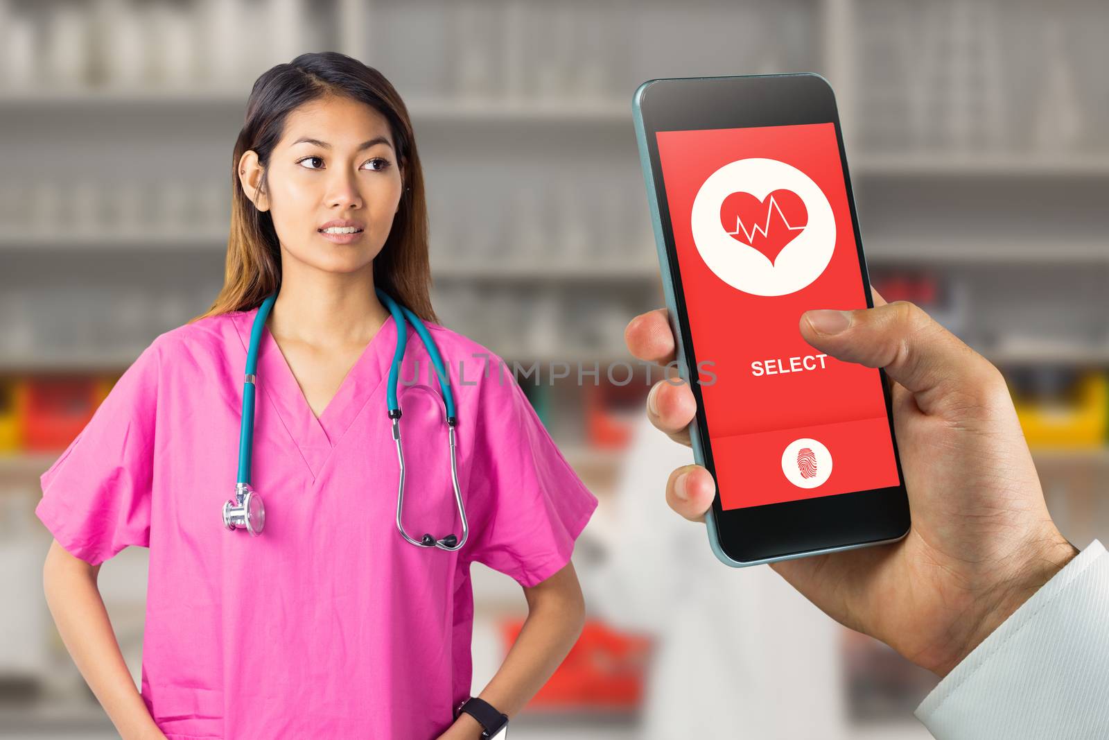 Asian nurse with stethoscope looking at the camera against serious female scientist writing on her clipboard