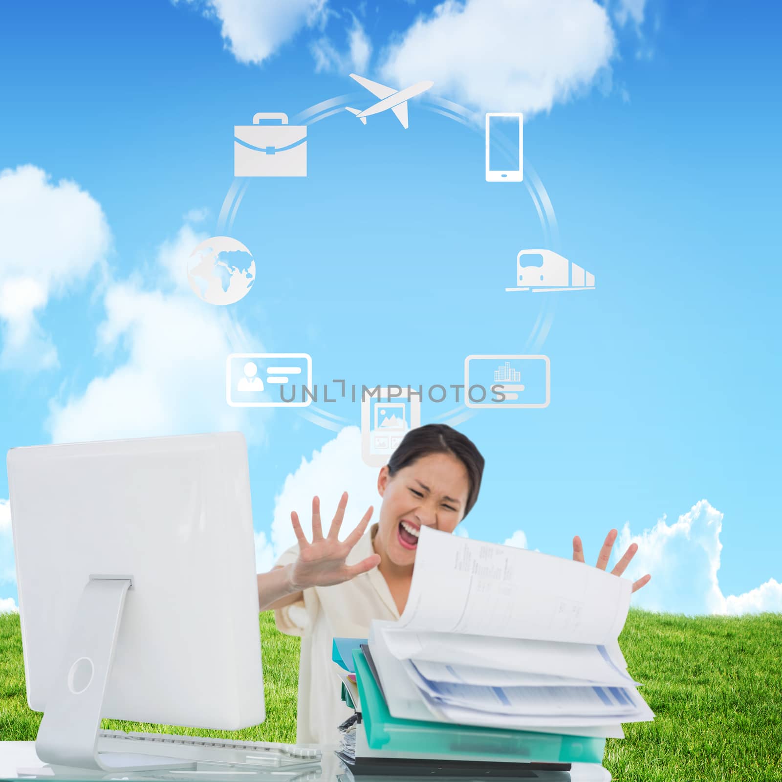 Businesswoman shouting with stack of folders at desk against sky and field