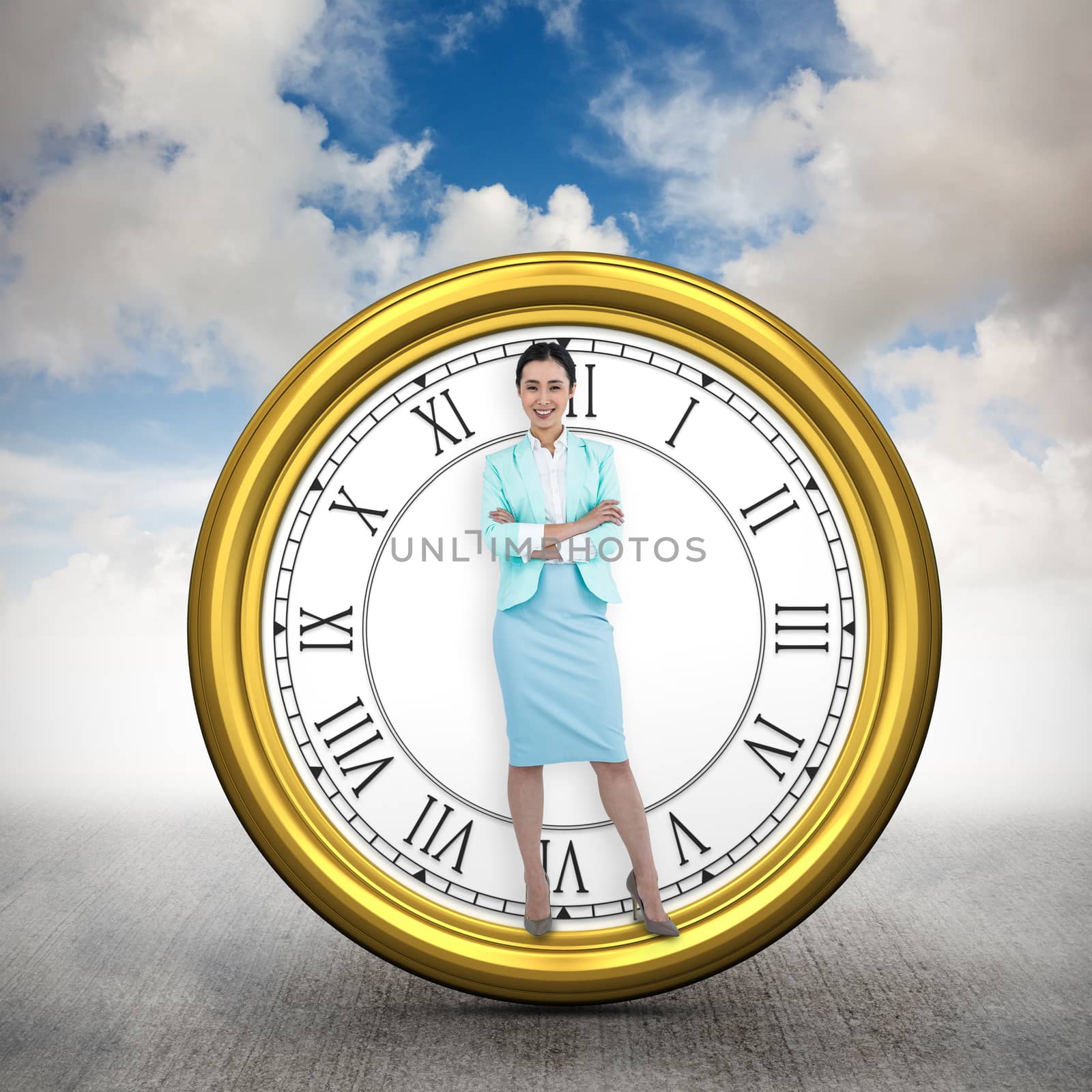 Elegant businesswoman with crossed arms  against blue sky