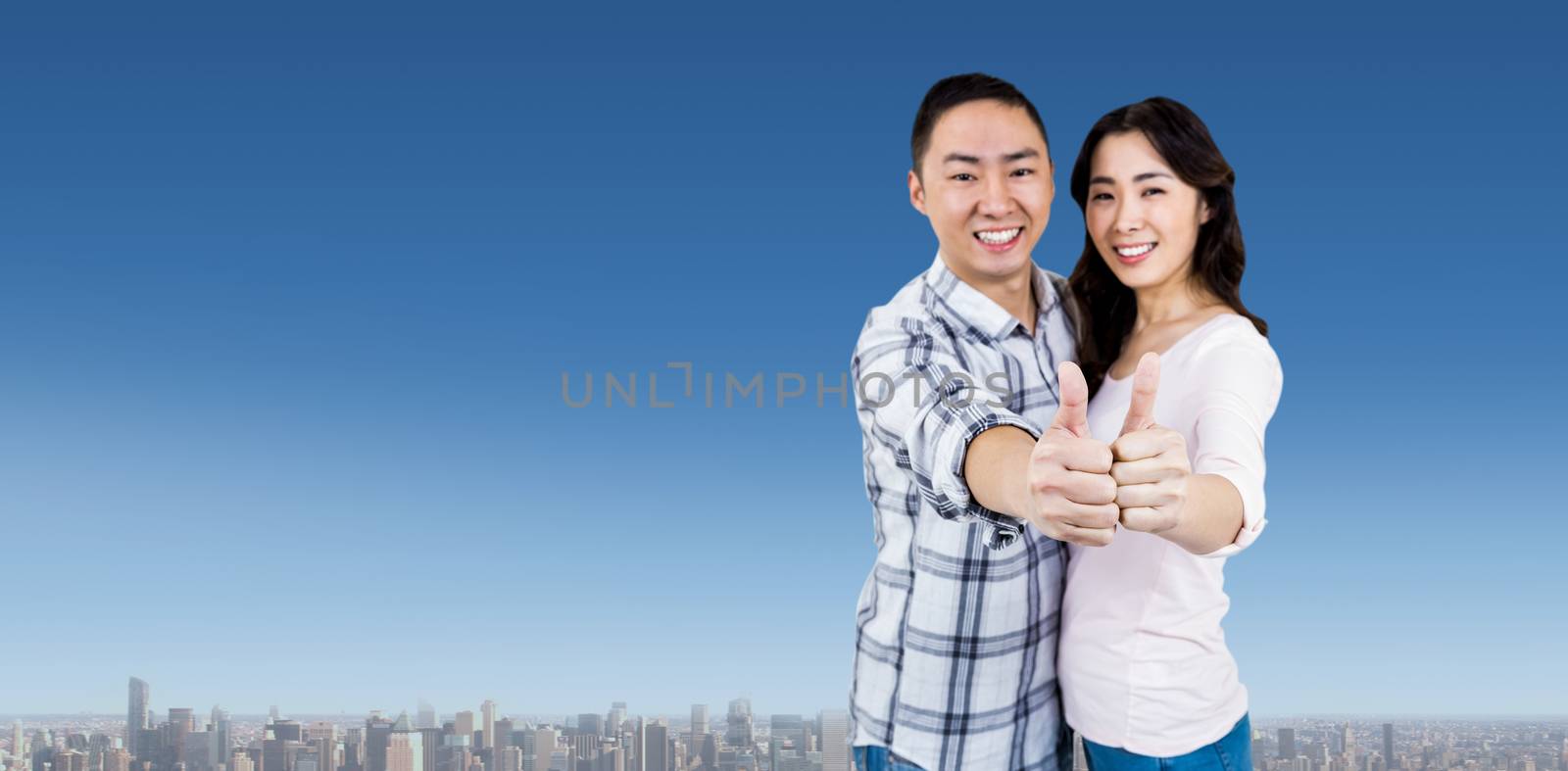Happy couple showing thumbs up against white background against cityscape