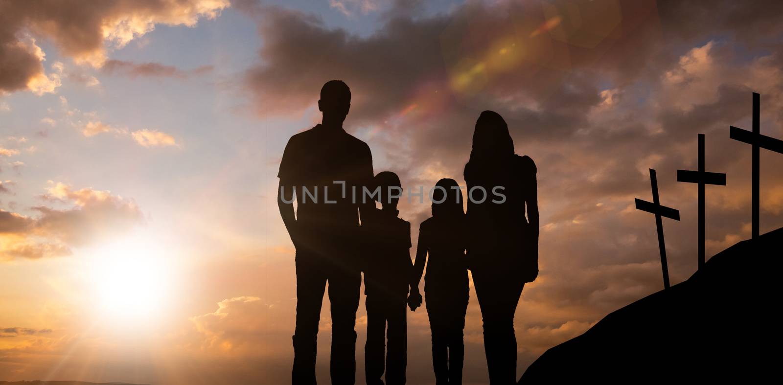 Cheerful family holding hands against cross religion symbol shape over sunset sky 