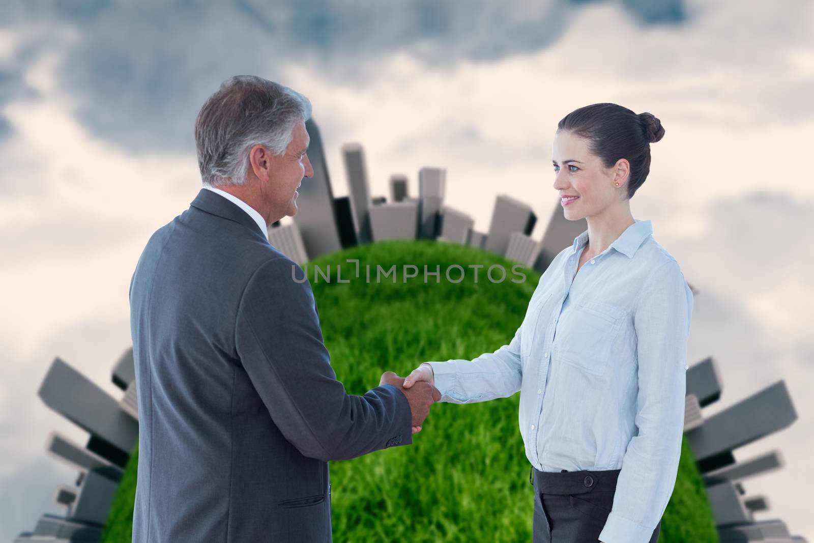 Business people shaking hands against painted sky