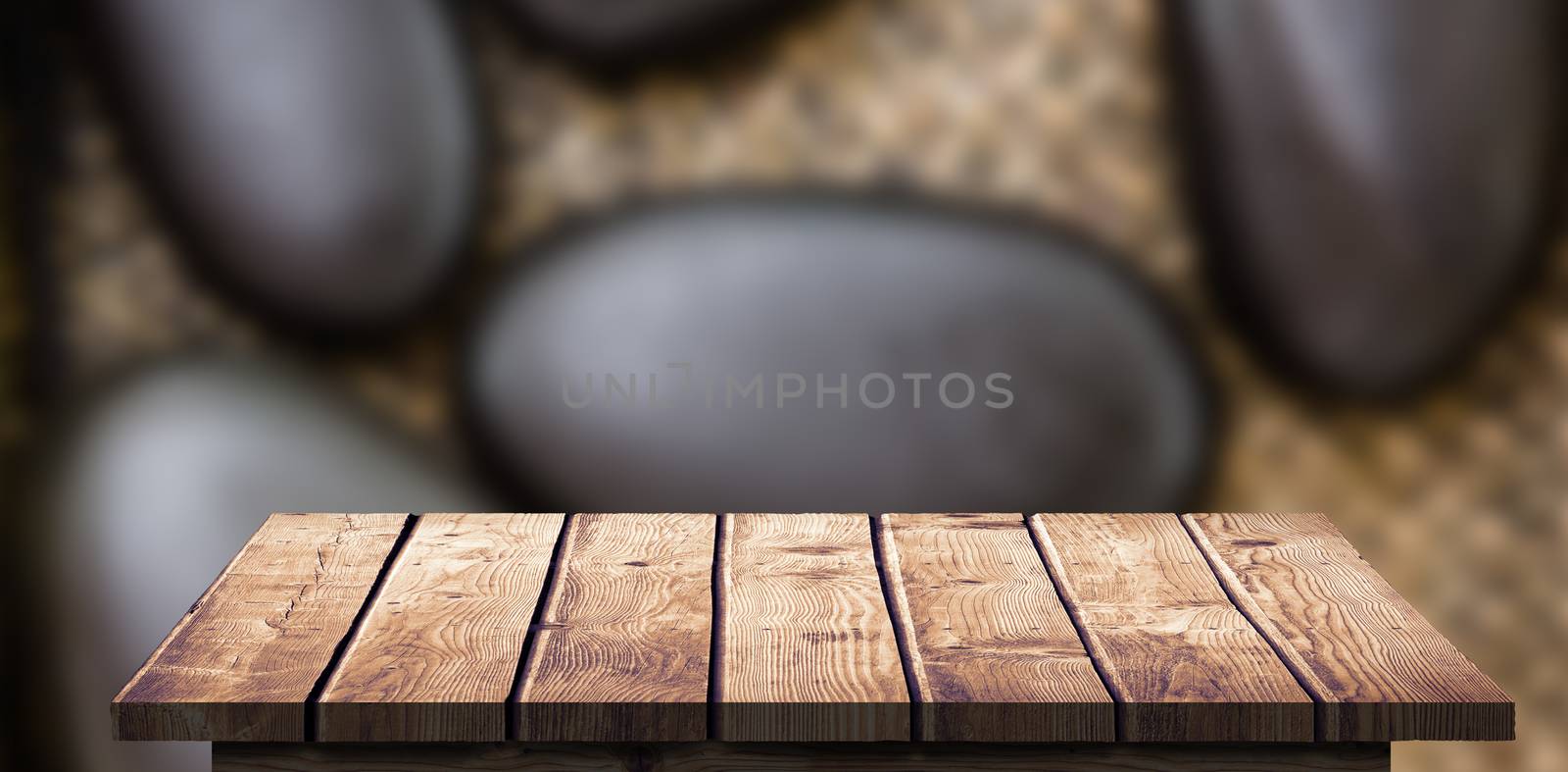 Wooden Floor against a pile of black stones