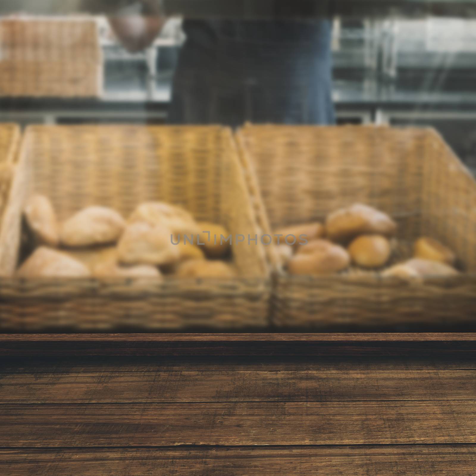 High angle view of wooden flooring against smiling waiter in apron choosing bread 