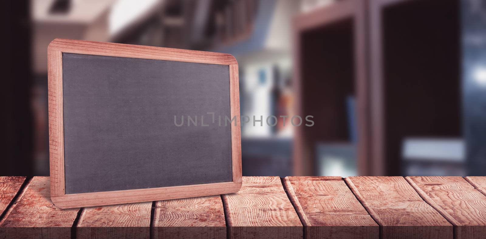 Alcohol bottles arranged in a shelf against chalkboard