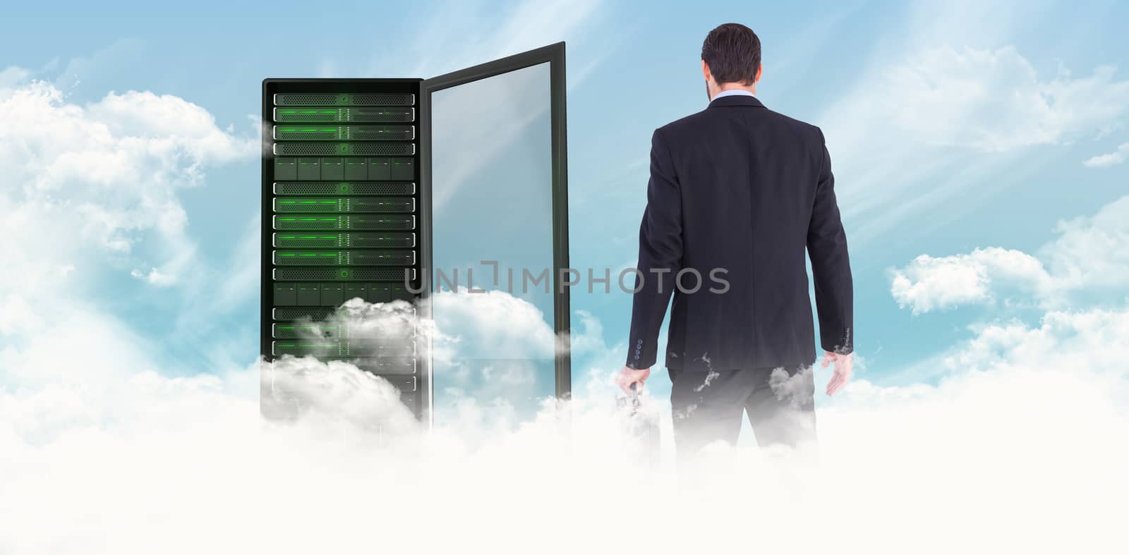 Composite image of rear view of businessman holding a briefcase by Wavebreakmedia