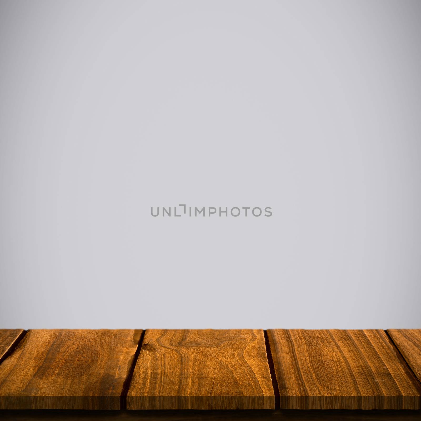 Wooden table against light grey