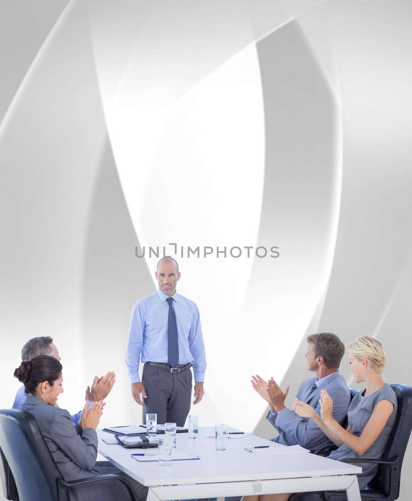 Business people applauding during meeting  against white angular design
