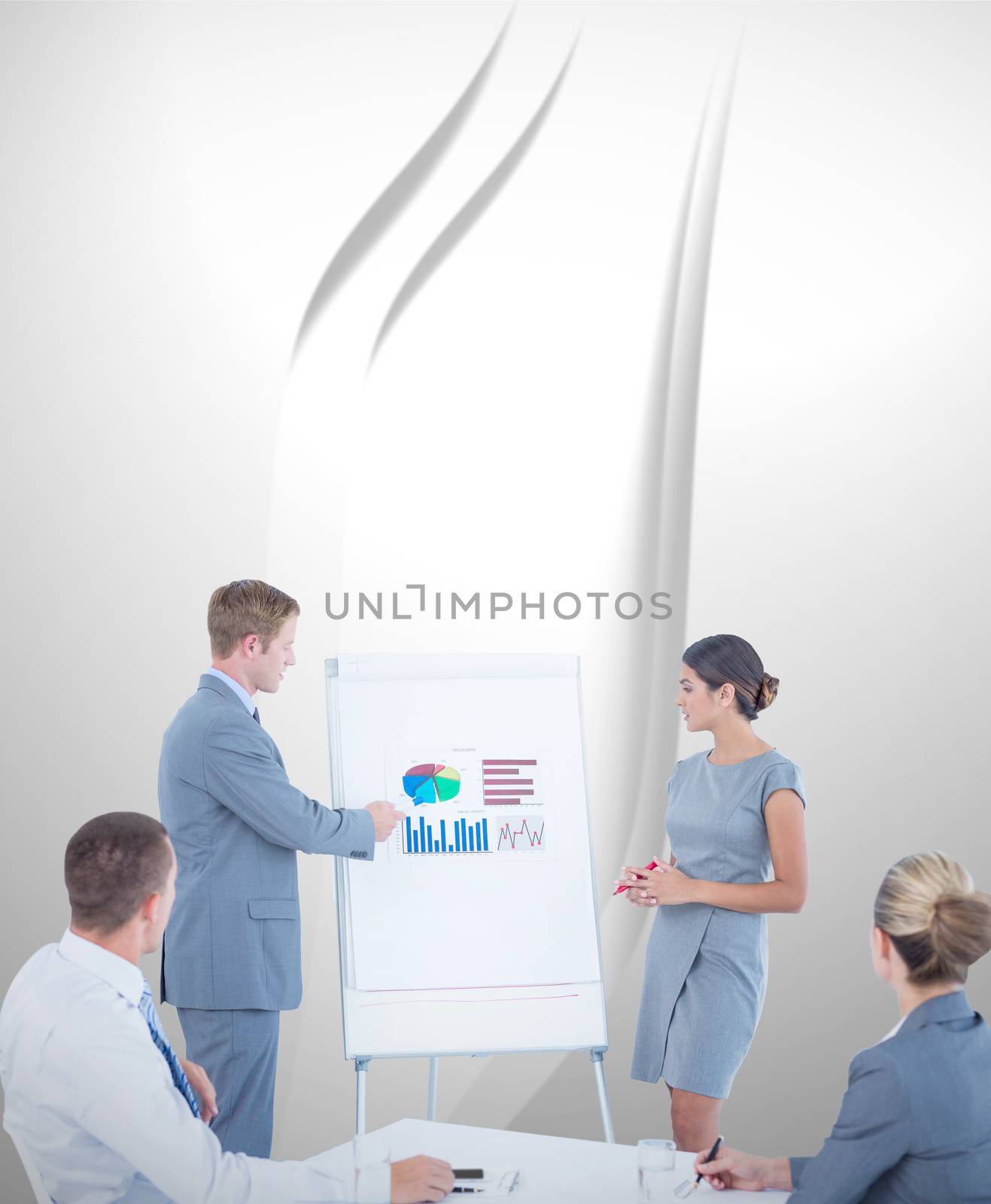 Composite image of manager presenting statistics to his colleagues by Wavebreakmedia