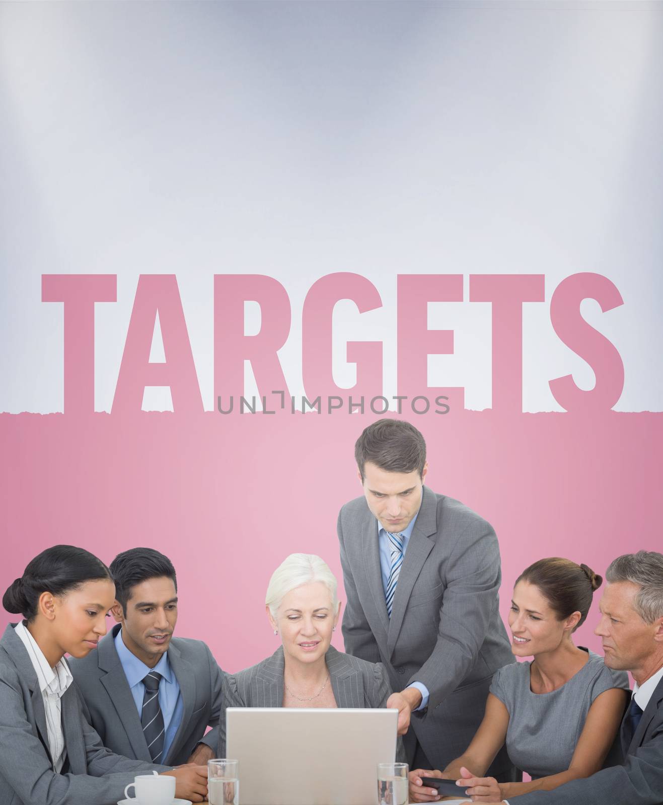 Business people using laptop  against targets