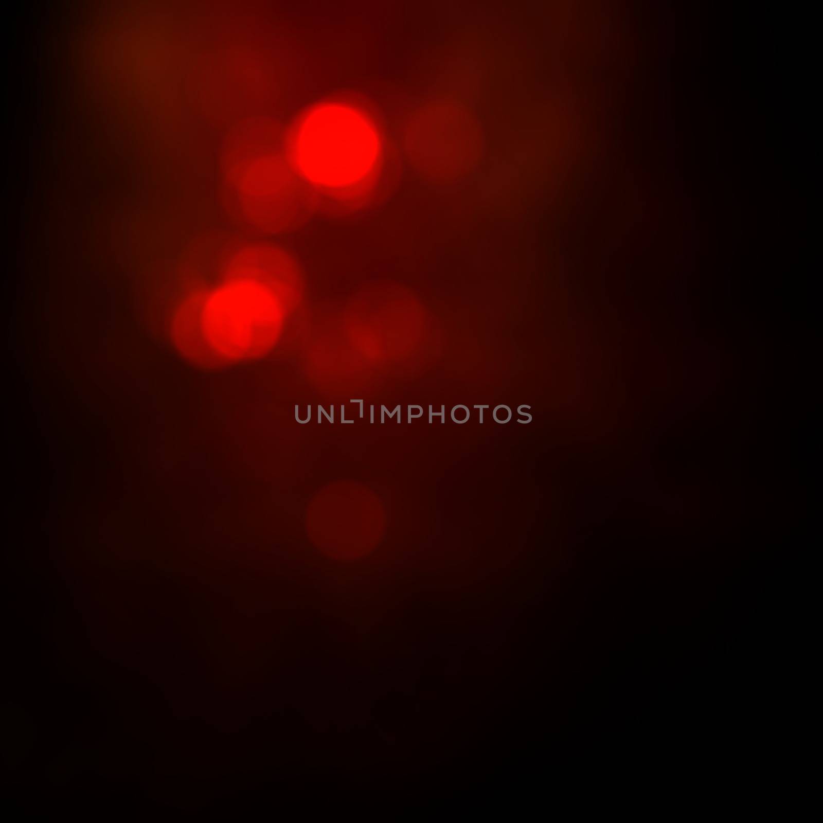 Dark background with red lights
