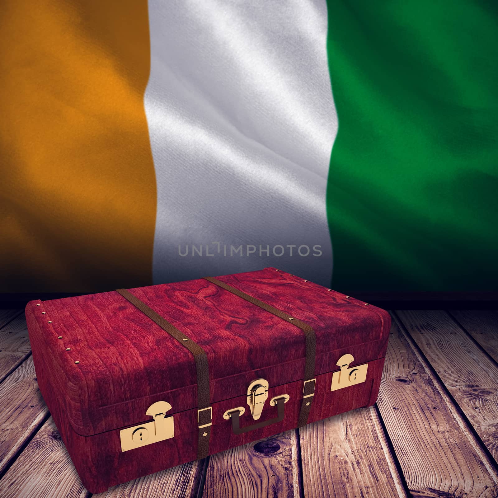 Wooden suitcase against ivory coast national flag