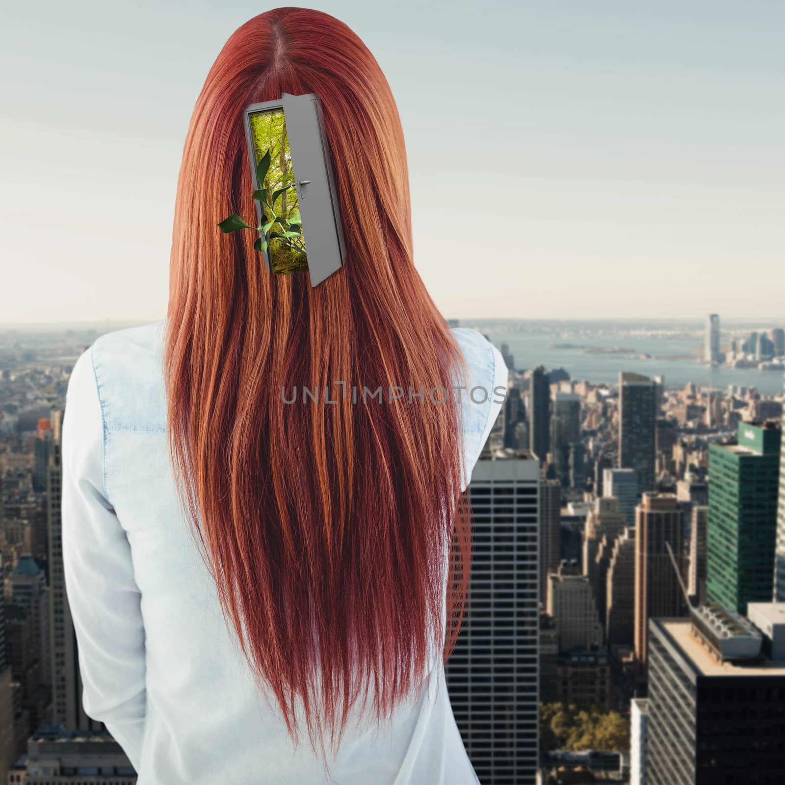 Rear view of hipster woman looking post-it against city skyline