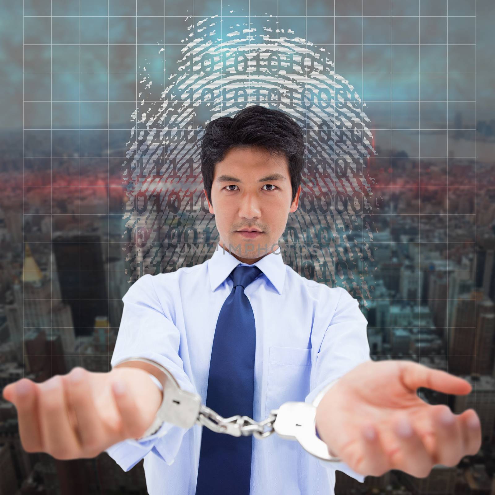 Composite image of businessman with handcuffs by Wavebreakmedia