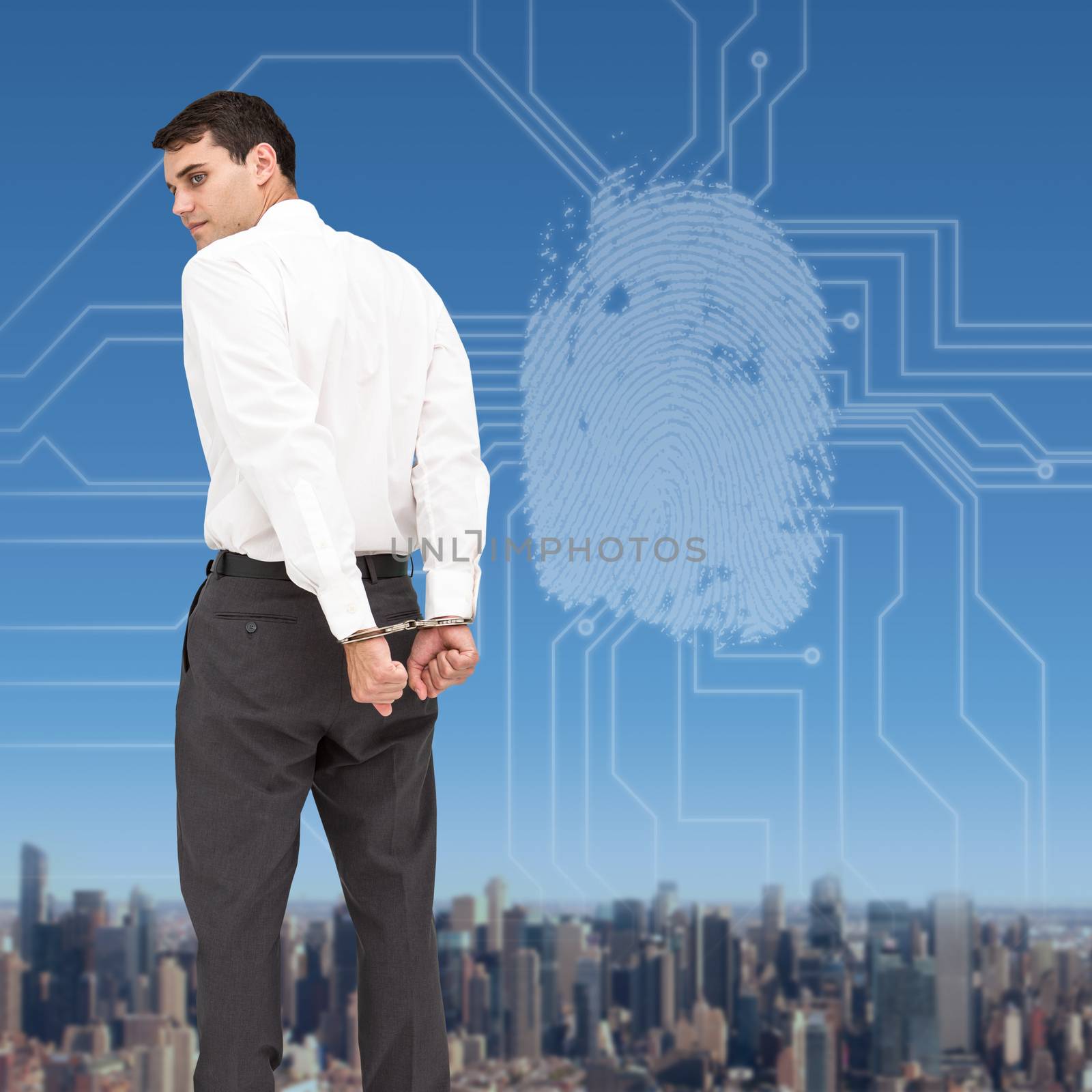 Composite image of businessman wearing handcuffs by Wavebreakmedia