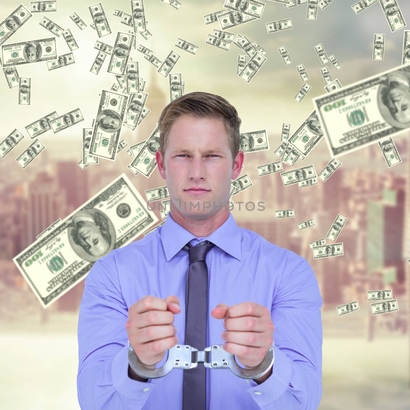 Composite image of handsome businessman wearing handcuffs by Wavebreakmedia