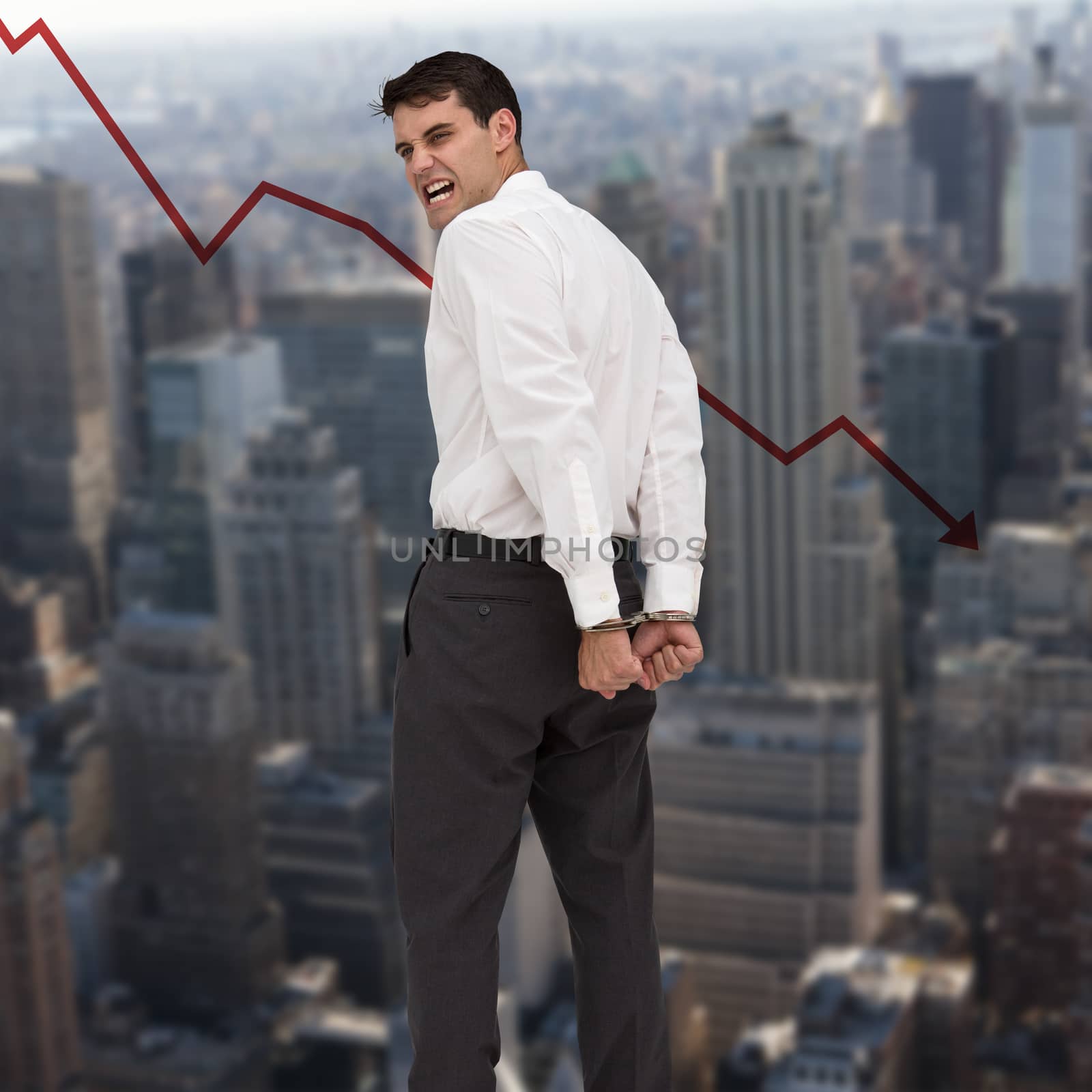 Composite image of rear view of young businessman wearing handcuffs by Wavebreakmedia