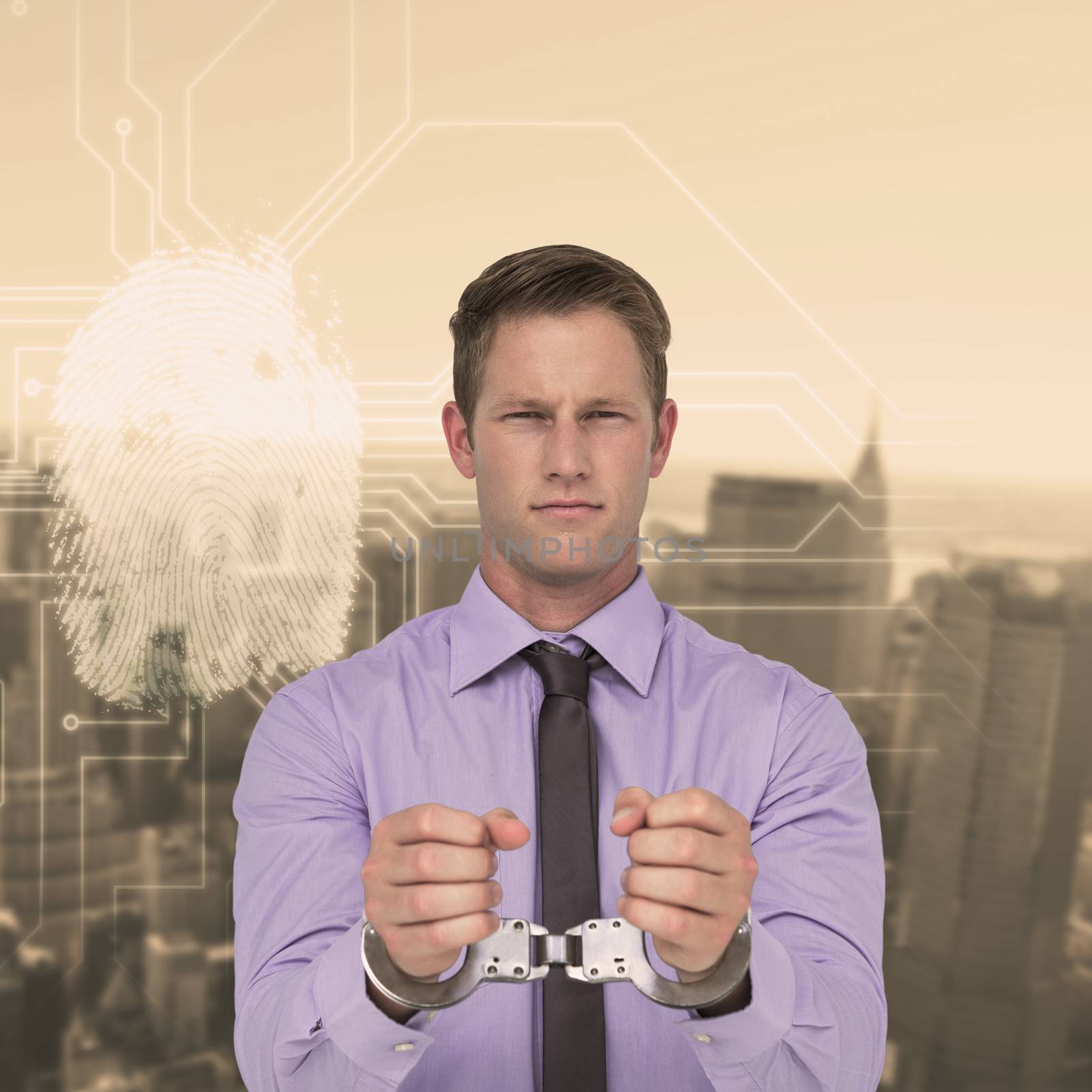 Handsome businessman wearing handcuffs against new york skyline