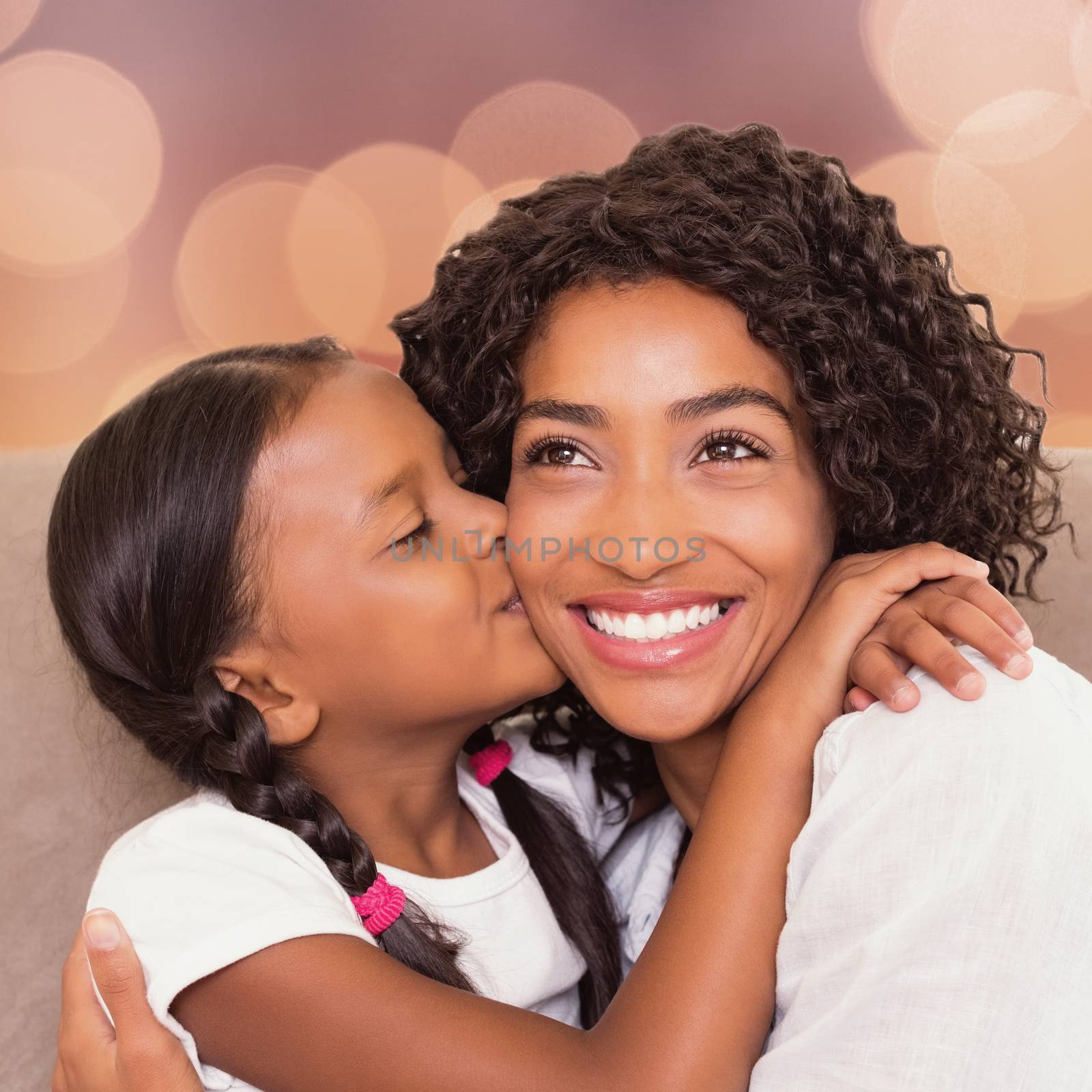 Portrait of a mother and daughter holding each other by Wavebreakmedia