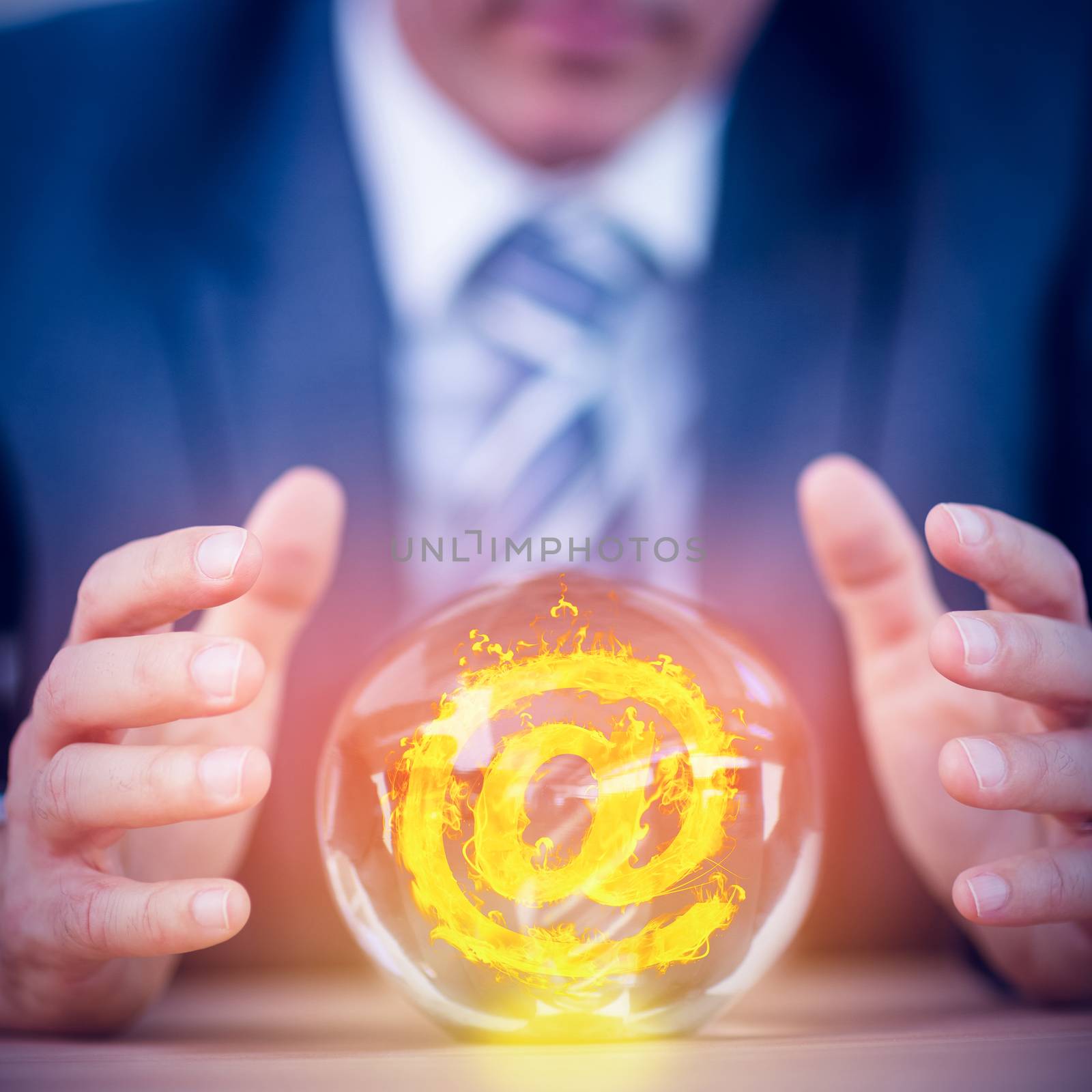 At in fire against businessman forecasting a crystal ball 