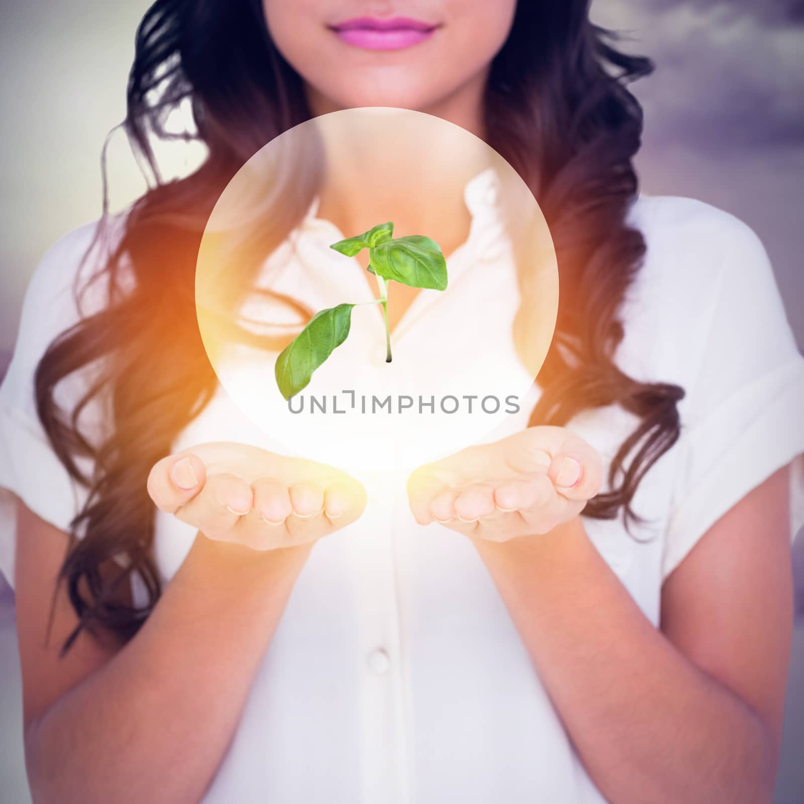 Composite image of pretty brunette holding out hands by Wavebreakmedia