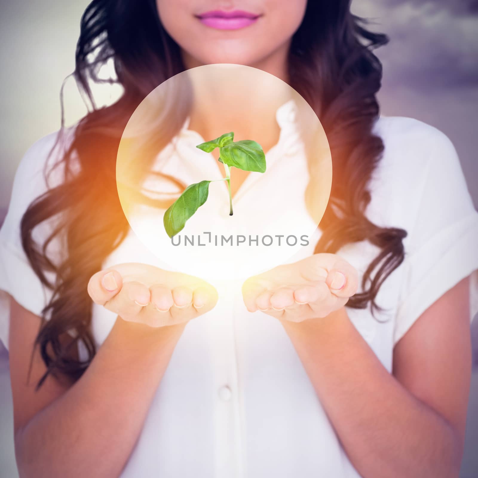 Pretty brunette holding out hands against room with large window looking on city