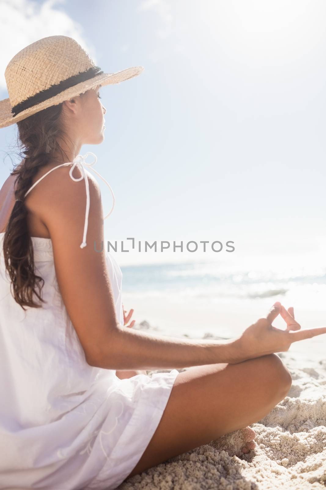  Rear view of woman performing yoga  by Wavebreakmedia